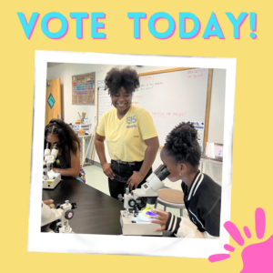 Woman teaching young girls science with microscopes. Text: Vote Today!